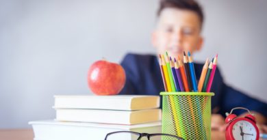 boy looking on a tidied desk