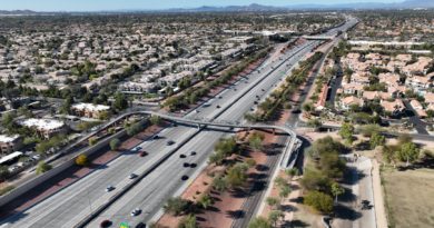 aerial photography of highway between towns