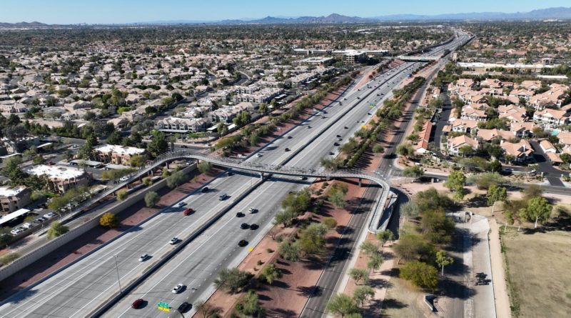 aerial photography of highway between towns