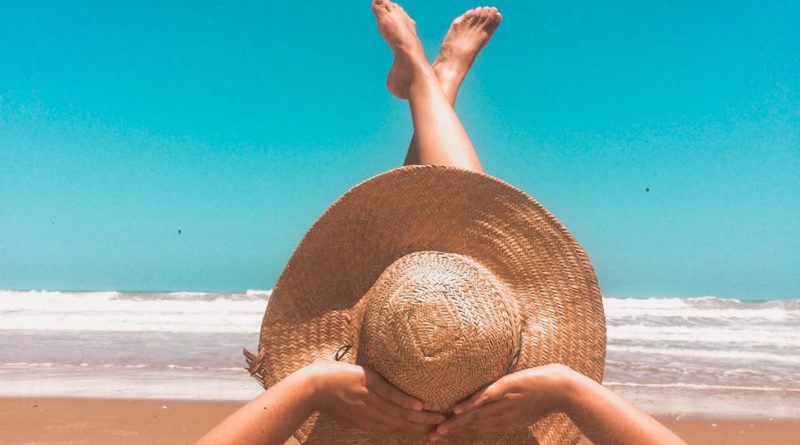 person laying on sand
