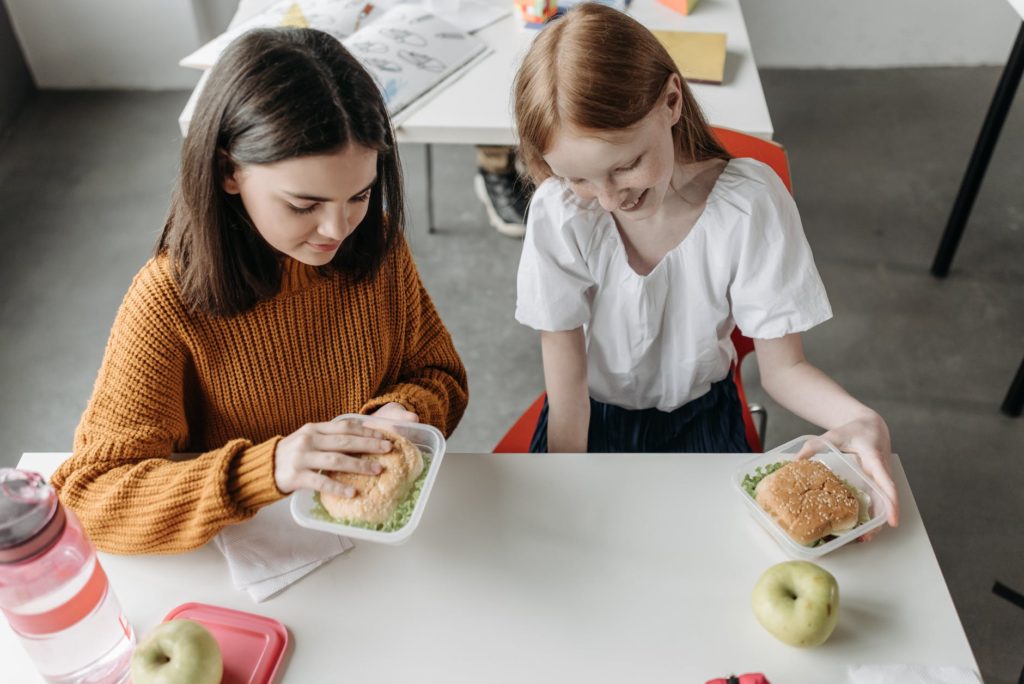 girls sitting at the table