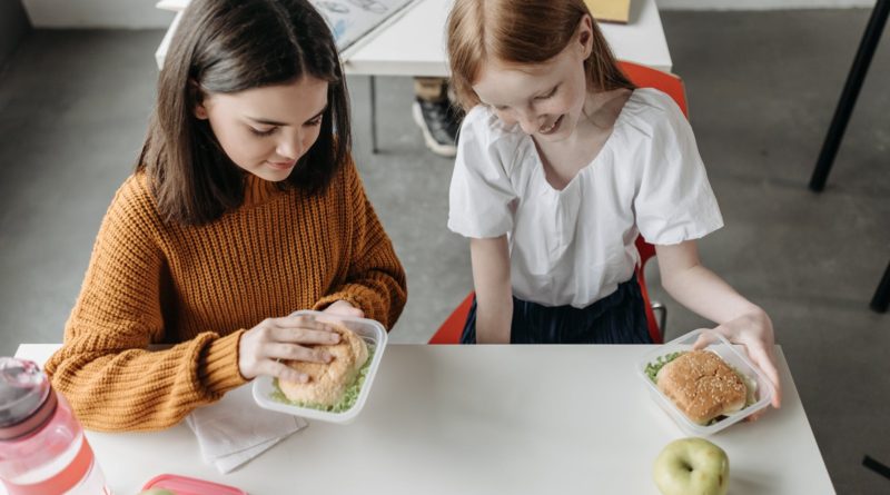 girls sitting at the table